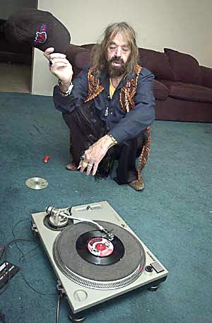 Sky himself listening to "Amnesty" (photo from the Austin Chronicle).